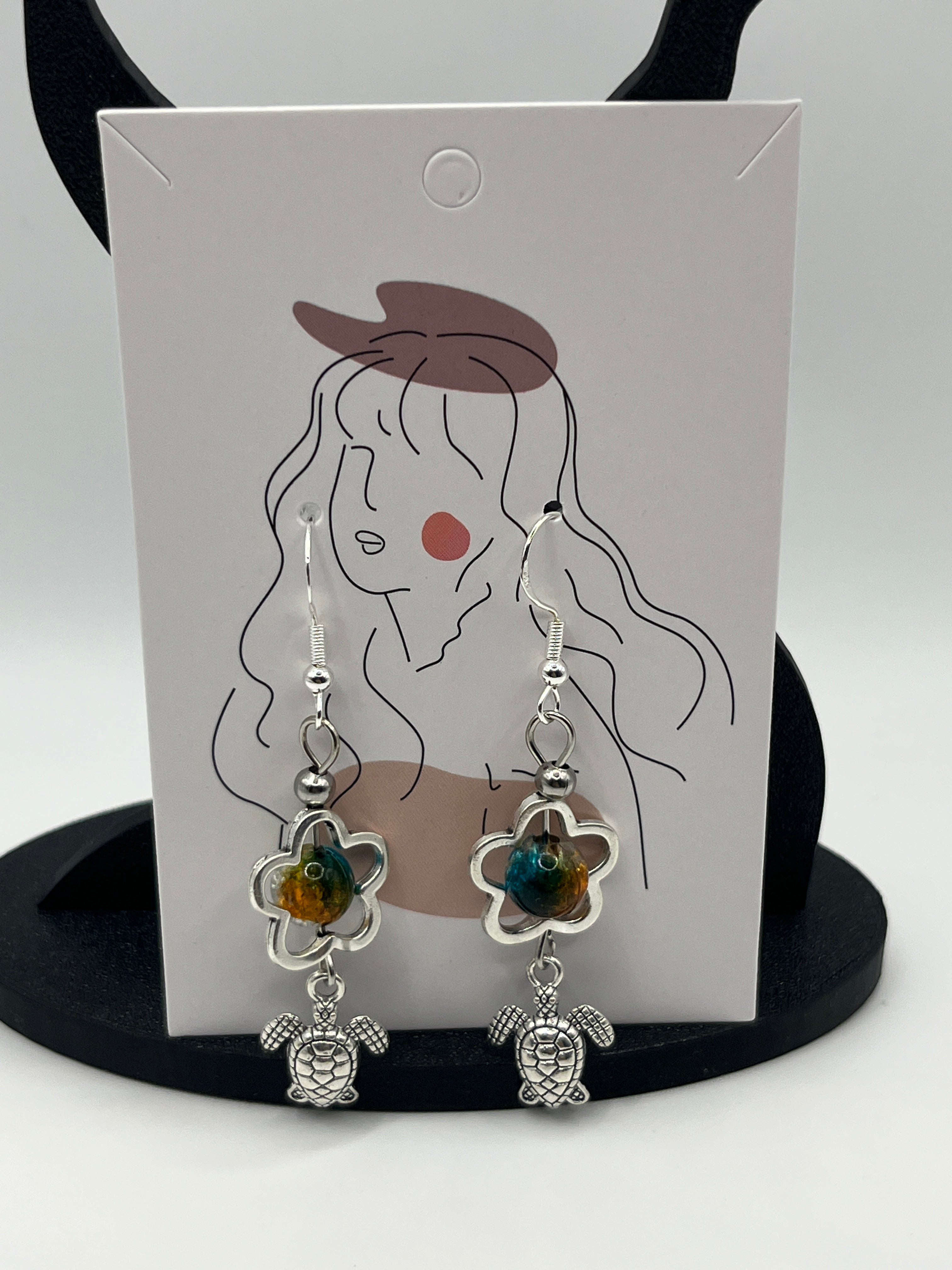 Boucles d'oreilles tortue/perle de verre fleur